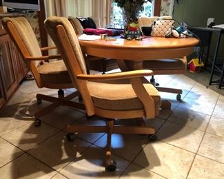 Dining Table with Rolling Chairs