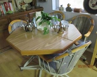 Breakfast table w/ 4 roller chairs.