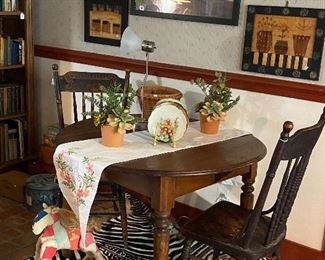 Charming table for two. Folk art by Paige Koosed,
Table and rug sold Thursday
