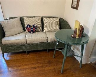 vintage wicker great condition, very old , $225.00 on settee with cushions, round table with glass $65.00