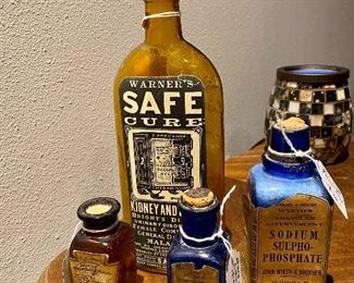 Vintage medicine bottles with labels and pills