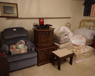 recliner, side tables, twin bed, stuffed animals