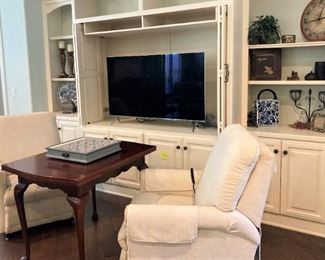White recliners; game table (doubles in size)