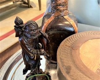 Asian figure; leather bottle