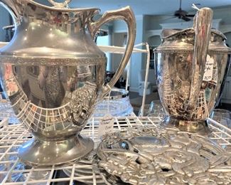 Silverplate pitchers; metalware trivet
