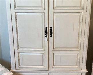 Light-colored TV armoire
