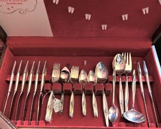 41 pieces of Reed and Barton silverplate with chest