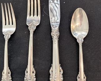 A few of the over 140 pieces of Grande Baroque sterling silver dinnerware by Wallace