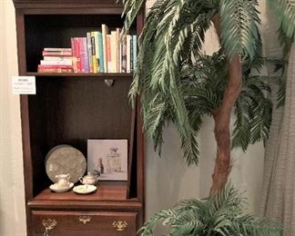 One of three wall units; artificial palm tree