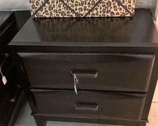 Black 2-drawer nightstand; leopard print bulletin board