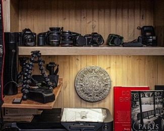 Great selection of vintage cameras. Most are in working order, a few need repairs. Also lenses (Canon EF and Canon FD), filters, photography books, tripods, light stand. photo printer, flashes, and various photo accessories.