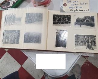 Old German soldier's World War 2 photo album with 124 photos and his handwritten comments in German.  Photos include military troops, guns, cannons, weaponry, landmark buildings, zeppelins, etc.  Amazing piece. 