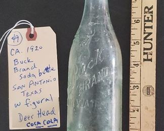 Buck Brand straight sided Coca Cola soda bottle from San Antonio Texas with embossed figural stag head.  ca 1920.  