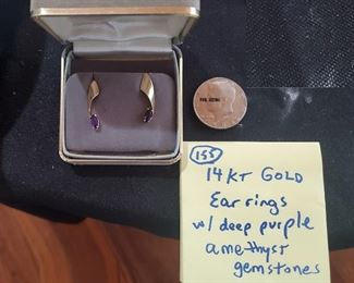 14 k gold earrings w deep purple amethyst gemstones. 