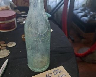 Bottle is marked with an E inside a diamond and says Soda Water, Coca Cola bottling Co, Corsicana, Texas. 