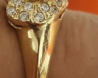 14k gold diamond ring with dark faceted gemstone, probably garnet or dark amethyst.  Ring is marked 585 (14k).  Diamonds test genuine. 