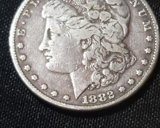 Morgan dollar 1882, several different dates in this sale. 