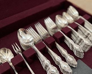 Several sets of silver plate and stainless flatware 