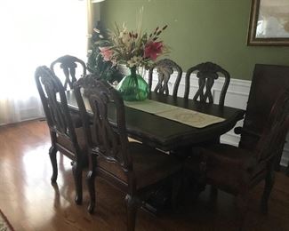 Used twice formal dining room with leaf and six chairs. Two armchairs.  
Mahogany stain.  Like New.  