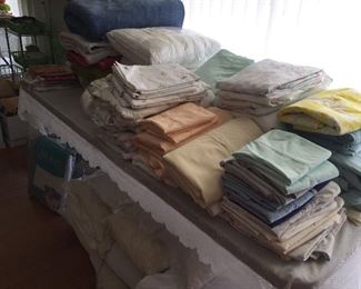 Tons of linens - Sheets, pillowcases, blankets, bedspreads and more.