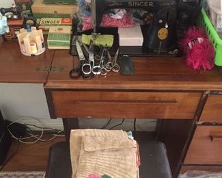 Antique Singer sewing machine, sewing cabinet and notions.