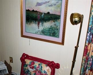 Framed print, pillows, brass floor lamp