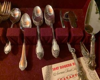 #3	Rogers silver plate 8 piece flat ware with serving pieces  in box 	 $65.00 			
