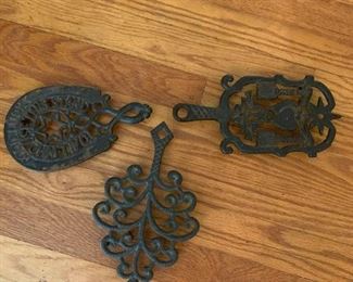 #25	3 case iron trivet hot plates on feet with stars designs 	 $30.00 			

