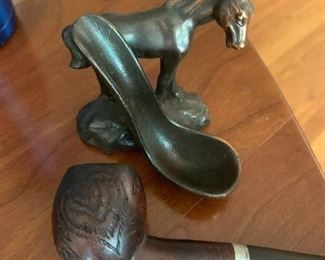 #31	metal horse pipe stand with pipe with craving on tit 	 $20.00 			
