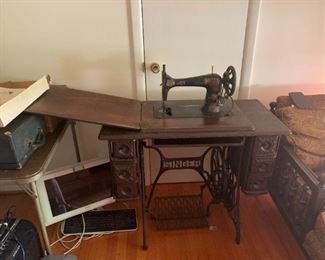 #40	singer tredle sewing machine as is machine no bobbin with 4 drawer cabinet	 $75.00 			
