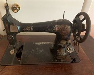 #40	singer tredle sewing machine as is machine no bobbin with 4 drawer cabinet	 $75.00 			

