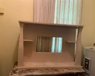 #75	white painted shelf that could seat on cabinet or hang on wall 42x10x24	 $20.00 			
