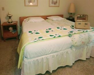 Twin beds pushed together. Quilt is sold.