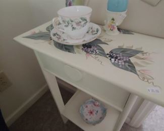 Painted table with fold out compartment. 
