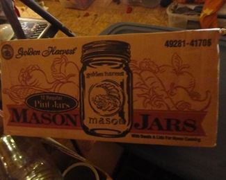 Multiple boxes of canning jars and lids