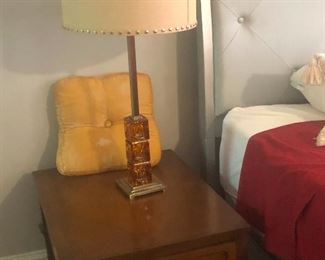 Why is there a pillow on the table? Does the table have a headache? And that lamp has an amber lucite base!!