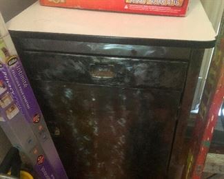 antique deco machine age brushed metal cabinet just sitting there in the garage like it's not 92 years old.