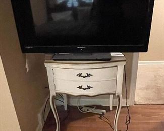 Several nice flat screen TVs with nice TV stands