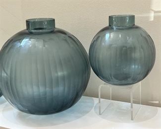 rio of Quality Art Glass Style Vases in a gorgeous hue of blue. These make a lovely display anywhere in a room from a table top to bookshelf and more! Purchased for $1,500.
Two measure approximately 7.75" with the largest one measuring 11.5" h