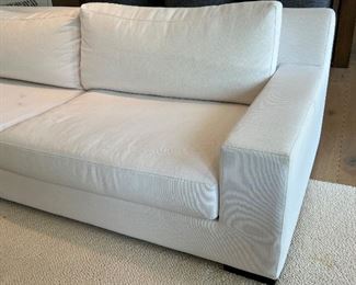 Restoration Hardware Sofa upholstered in a wonderful neutral shade of white. In overall good condition with some light stains that would likely come out with cleaning. Purchased new for $6,000.