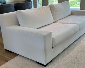 Restoration Hardware Sofa upholstered in a wonderful neutral shade of white. In overall good condition with some light stains that would likely come out with cleaning. Purchased new for $6,000.