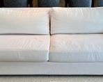 Restoration Hardware Sofa upholstered in a wonderful neutral shade of white. In overall good condition with some light stains that would likely come out with cleaning. Purchased new for $6,000.
