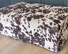 Amazing Animal Print Ottoman that measures 49x31x16 inches. Great decor piece in good condition with light wear.