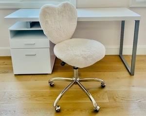 Delightful Pottery Barn White Desk with a Fun Fuzzy Chair. The desk measures 60x30x24 inches and it does have 2 drawers. This desk is accompanied by a fun fuzzy white chair with a heart shaped back.