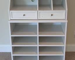 White Storage Shelf. There are some marks/paint spots that can be seen in the photos. Measures 32” wide, 18” deep and 42” high.