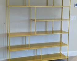Room and Board Yellow Foshay Bookshelf. There is a small paint spot that can been seen in the photos but in otherwise great condition. Measures 60” wide, 15” deep and 71.5” high.