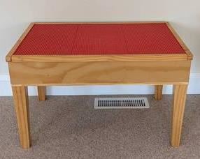 Lego Table. Perfect for your next big Lego construction! The Legos in the storage cubby are NOT included. Measures 32” x 22” and 19.5” high.