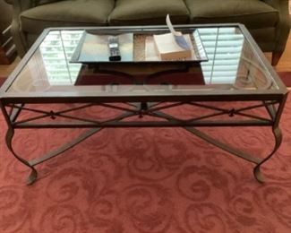 Iron coffee table with glass top.  Measures 43”l x 27” w x 20” h.  Purchased at Marshall Fields.  Presale $150