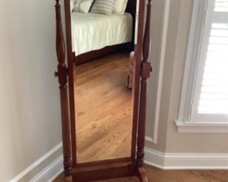 Floor standing mirror with wood frame. Measures 62” h x 23” w and has 24” base. Presale $85
