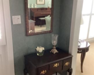 Entry table and mirror…measures 26” w x 15” d x 32” tall.  Table $95 and mirror $45.